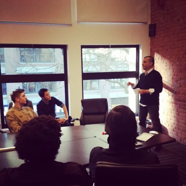 Rastin presenting Anahita around the table at Launch Academy, Vancouver